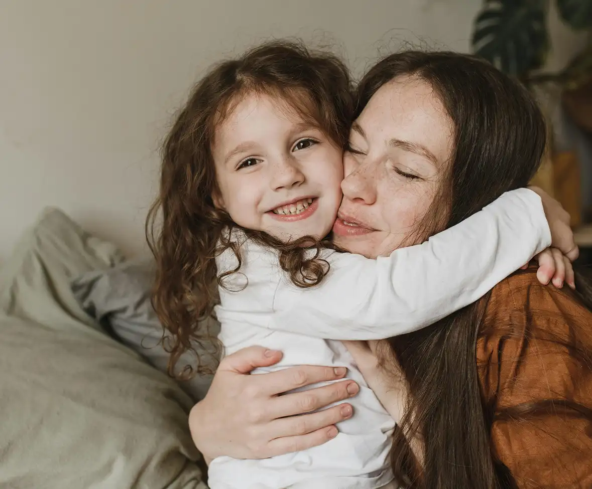 Mother and daughter hugging