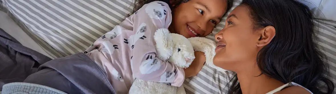 Mother and daughter hugging